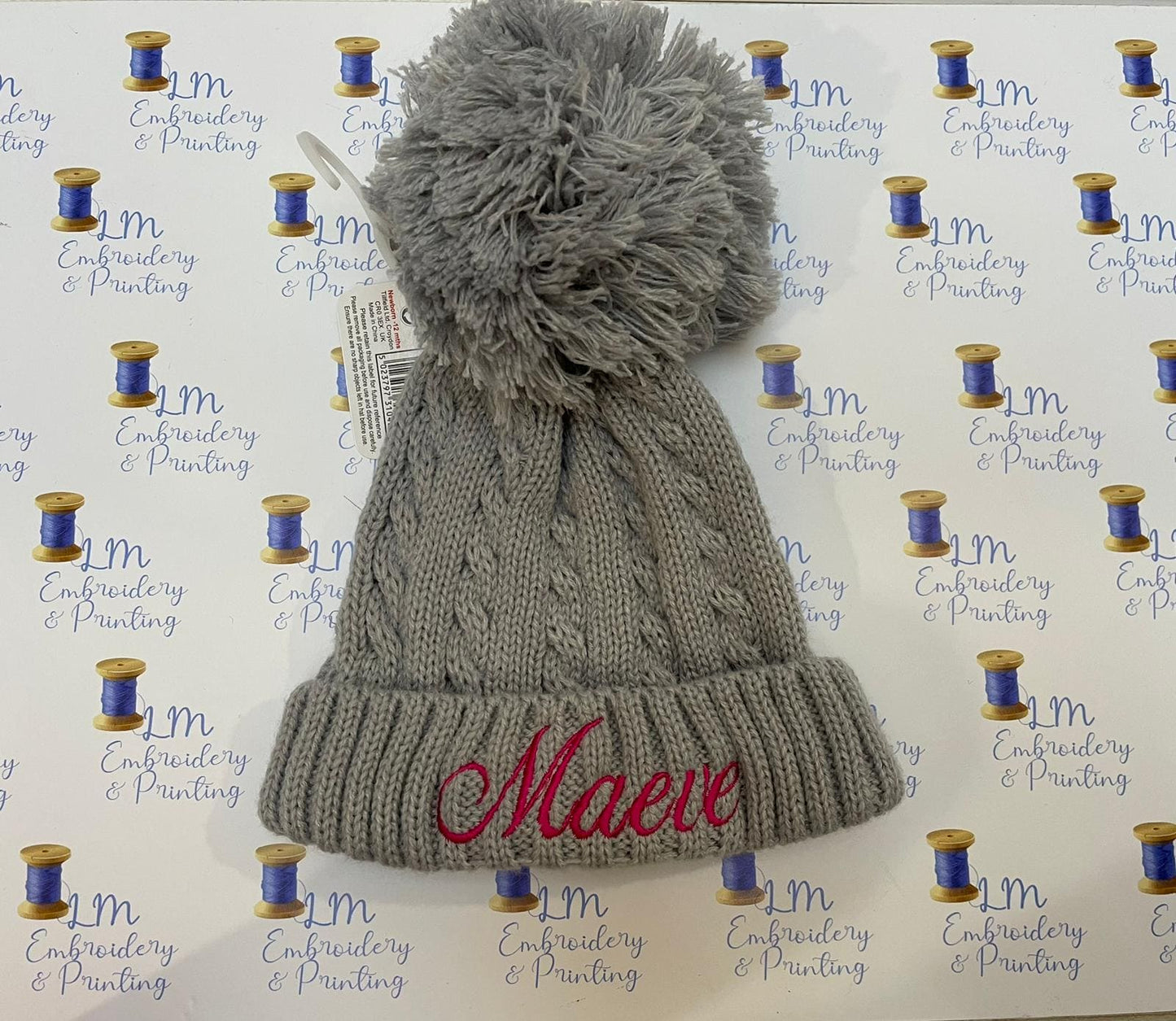 Grey pom pom knitted beanie