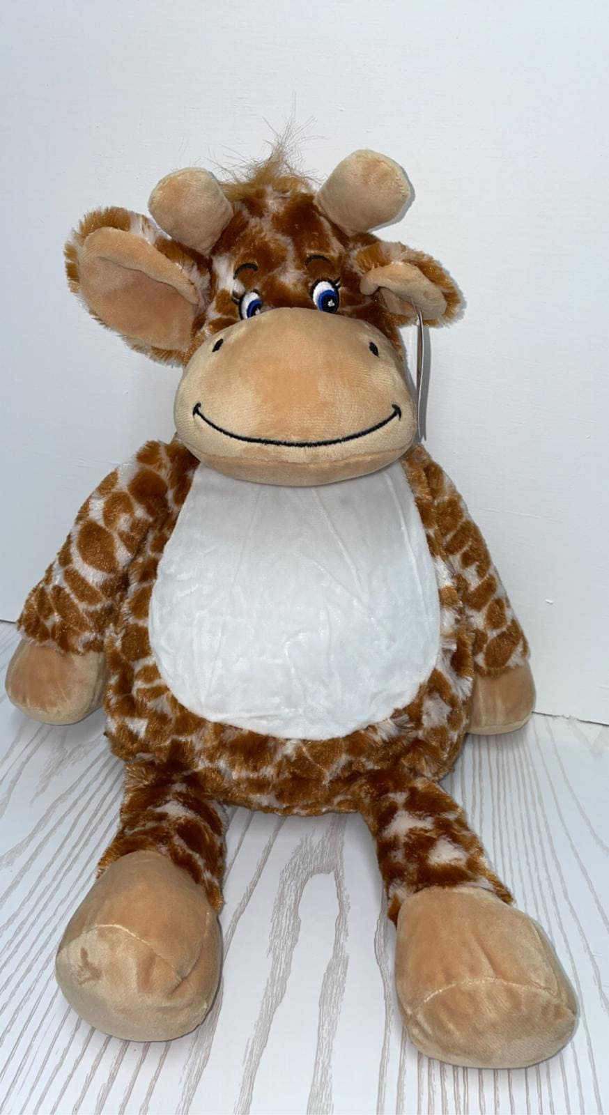 Teddy Giraffe with embroidered belly.