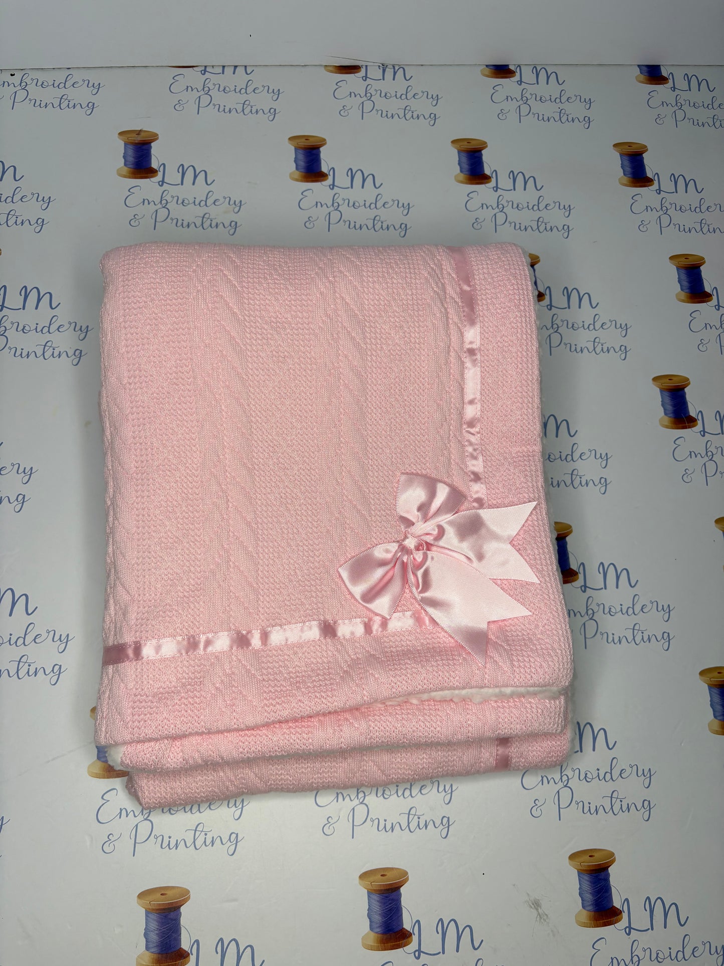 CHEVERON CABLE KNIT BLANKET WITH TRIM & BOW
