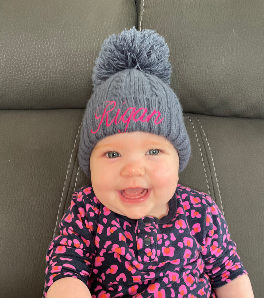 Navy pom pom knitted beanie